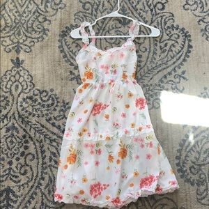 Floral dress with an open back and cute tie!